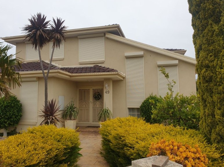 beautiful home in Melbourne with custom made roller shutters